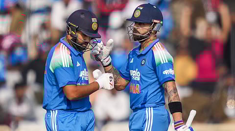 India's Virat Kohli, right, and Rohit Sharma greet each other between the wickets during the first ODI cricket match