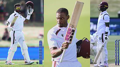 West Indies' Justin Greaves raises his bat Shai Hope, Kemar Roach