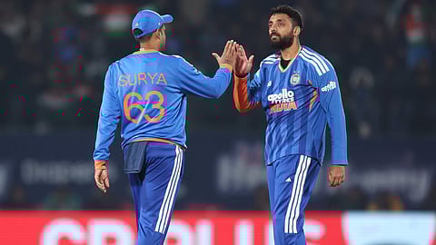 Varun Chakravarthy celebrates his wicket.