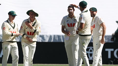 Australia's Scott Boland, third right, gets a pat on the head from teammate Mitch Starc