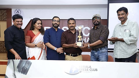 Photographer A Sanesh receives the Gafoor Moodadi Press Photo Award