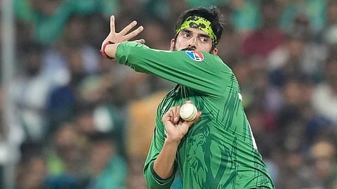 Pakistan's Usman Tariq bowls a delivery during the T20 World Cup cricket match