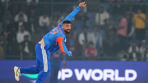 India's Varun Chakravarthy bowls a delivery during the T20 World Cup cricket match