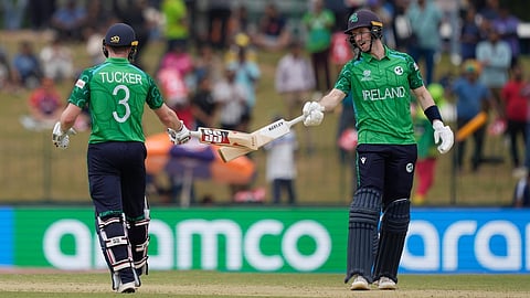 Ireland's Lorcan Tucker, left, George Dockrell, right, encourage each other as they bat during the T20 World Cup cricket match
