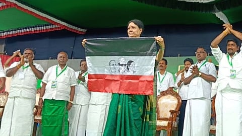 VK Sasikala unveils her new party flag during a public meeting held in Ramanathapuram district