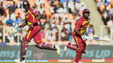 West Indies' Jason Holder, left, and batting partner Romario Shepherd run between the wickets
