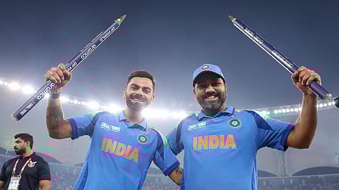 Virat Kohli and Rohit Sharma pose with the stumps after India's triumphant victory in the ICC Champions Trophy 2025 final