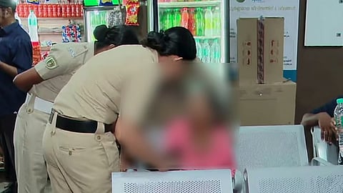 Elderly woman in KSRTC stand