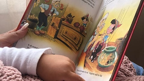 child reading book