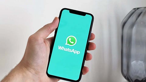 image of a smartphone with WhatsApp as wallpaper