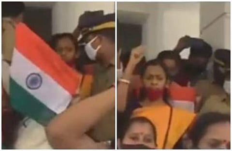 സിപിഎം കൗണ്സിലര്മാര് ദേശീയ പതാകയുമേന്തി പ്രതിഷേധം നടത്തുന്നു