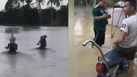 കഴുത്തോളം വെളളം, ഹാന്ഡിലും മറഞ്ഞ് ഒഴുക്ക്; വെളളപ്പൊക്കത്തിലൂടെ ബൈക്ക് ഓടിച്ച് യുവാക്കള്, അതിസാഹസികത (വീഡിയോ)