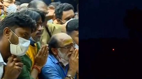 പൊന്നമ്പലമേട്ടിലെ മകരവിളക്ക് ദര്ശിക്കുന്ന ഭക്തര്/ ടെലിവിഷന് ചിത്രം