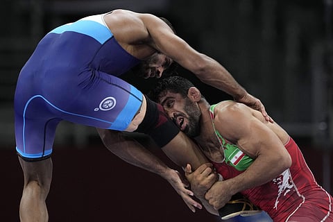 ഇറാന് താരം മൊര്തേസ ഗിയാസിക്കെതിരെ ഇന്ത്യയുടെ ബജ്റംഗ് പൂനിയ/ഫോട്ടോ: എപി