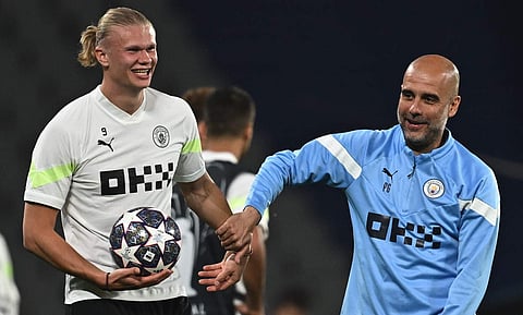 ഹാളണ്ടും ഗെർഡിയോളയും പരിശീലനത്തിനിടെ/ എഎഫ്പി