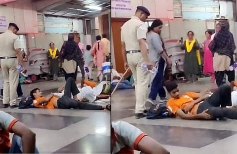 യാത്രക്കാരുടെ മുഖത്ത് വെള്ളമൊഴിച്ച് പൊലീസുകാരൻ/ ട്വിറ്റർ