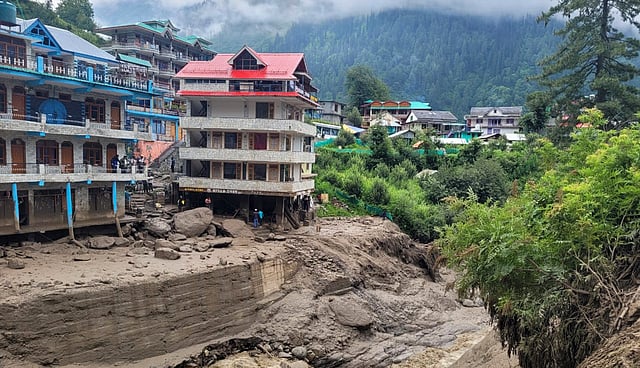 Footbridge, makeshift sheds washed away in flash flood in Kullu .