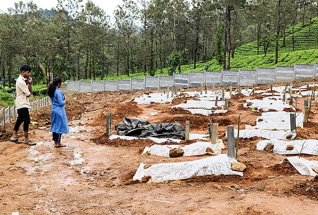 Shruthi and Jenson at the Puthumala graveyard, in Wayanad.