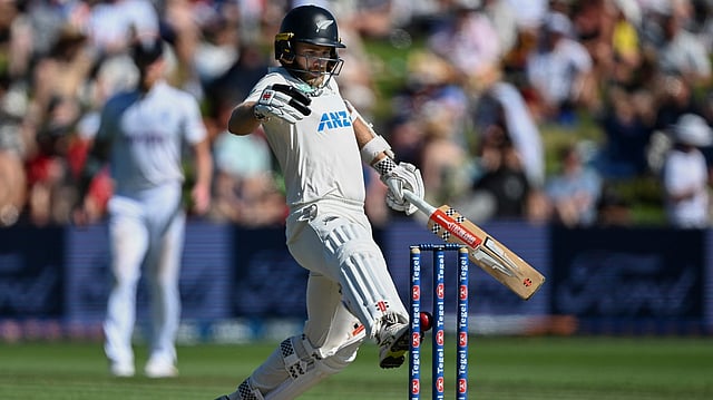 Kane Williamson kicks ball onto stumps