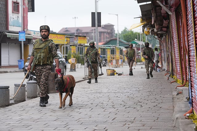 Security personnel with sniffer dog keep vigil amid prevailing India-Pak tensions