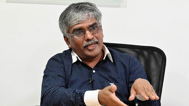 Dr. BAIJU