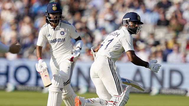 India's batters KL Rahul and Akash Deep run between the wickets during the fourth day of the third Test match