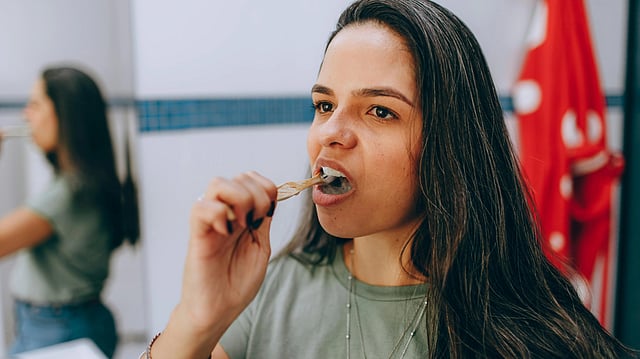 woman tooth brushing