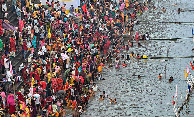 people take a holy dip in the Ganga River on the first day of the four-day-long 'Chhath Puja