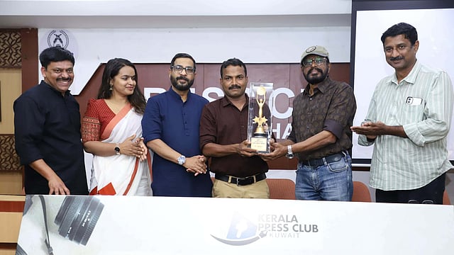 Photographer A Sanesh receives the Gafoor Moodadi Press Photo Award