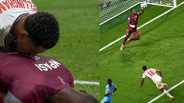 Congo goalkeeper Lionel Mpasi (1) saves from England's Jude Bellingham (10) during the World Cup round of 32 soccer match between England and Congo