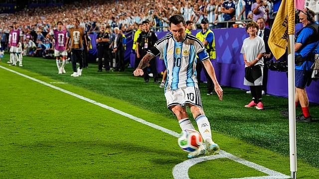 Argentina's Lionel Messi (10) takes a corner kick during the World Cup quarterfinal soccer match against Switzerland in Kansas City