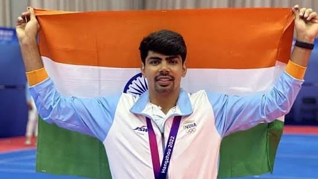 ഏഷ്യൻ ​ഗെയിംസ്; തജീന്ദർപാൽ സിങ് അല്ല, പവൻ സെഹ്‍രാവത് ഇന്ത്യൻ പതാകയേന്തും; കാരണമിത്
