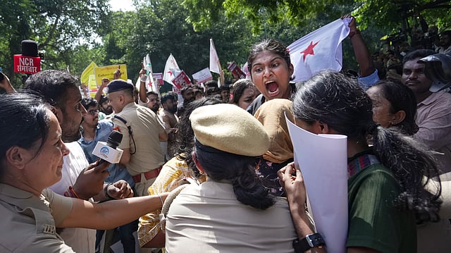 People stage a protest against the CEC near the Jantar Mantar,