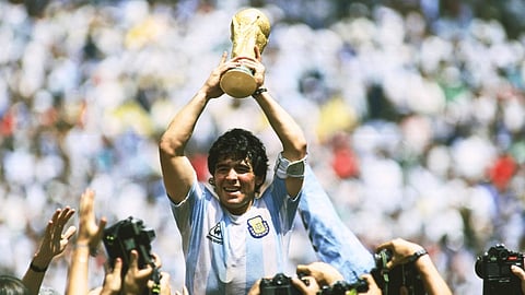 Diego Maradona with World Cup trophy in Argentina Jersey