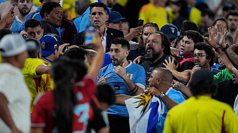 Uruguay players fight Colombia fans 