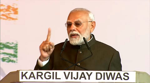 Narendra Modi speaks during a program to commemorate the 25th anniversary of the  Kargil Vijay Diwas
