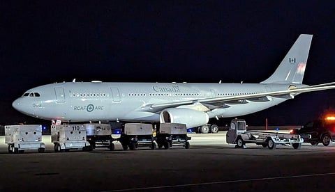Canadian Air Force plane ferries stranded Air India passengers from Iqaluit airport to Chicago .