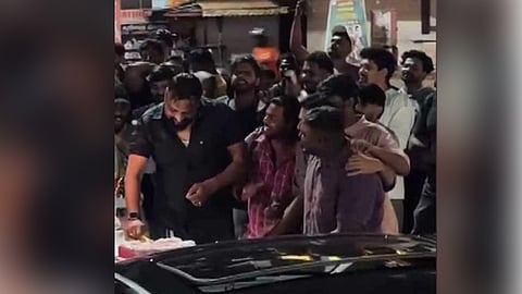 Around 20 cars lined up to celebrate the birthday of a DYFI worker by blocking the road