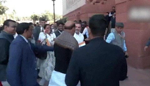 Rahul Gandhi gives rose, Tricolour to Rajnath Singh during Parliament protest
