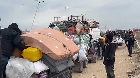 Palestinians return to Gaza, their homeland, with beds and household goods