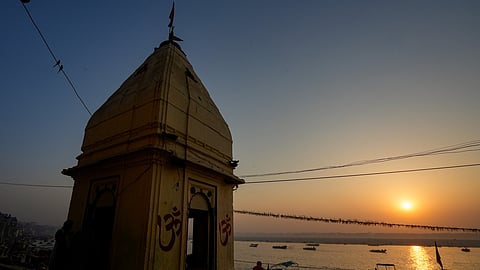 Maha Kumbh Mela 2025 Devotees take boat ride on Ganga river in Varanasi