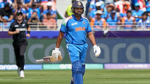 Rohit Sharma walks off after his dismissal