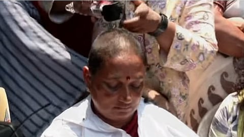 Asha protest by cutting hair in front of the Secretariat
