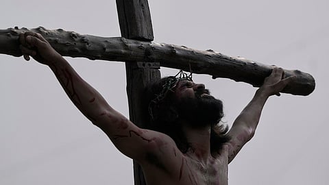 A Christian reenacts the crucifixion of Jesus Christ to mark Good Friday in Hyderabad