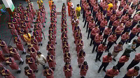 Students attend a prayer meet at a school