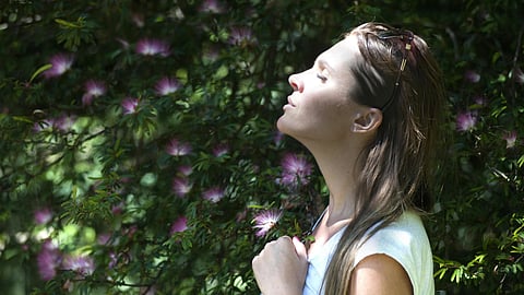 woman taking deep breath