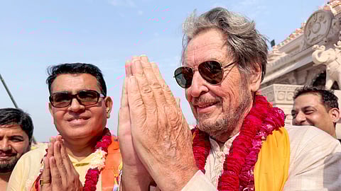Elon Musk's father Errol Musk, front right, offers prayers at the Lord Ram temple in Ayodhya