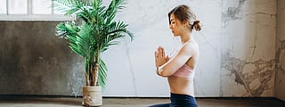 Woman Meditating With Candles