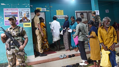 VOTERS REACHING POLLING STATION AMID RAIN IN NILAMBUR