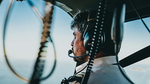 Photo of Man Flying a Helicopter